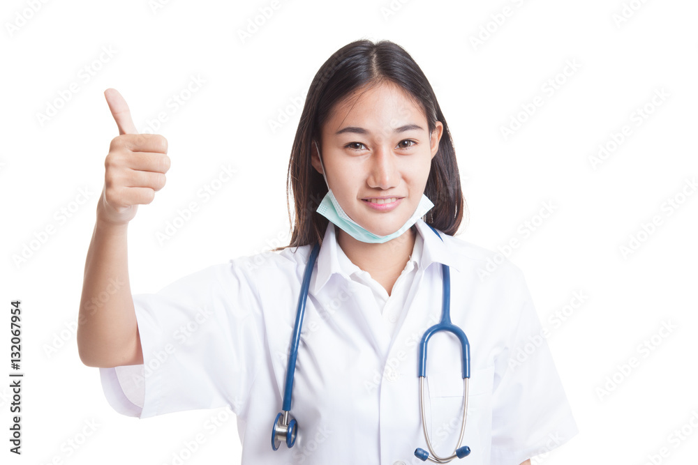Young Asian female doctor show thumbs up. Young Asian female doctor show thumbs up.