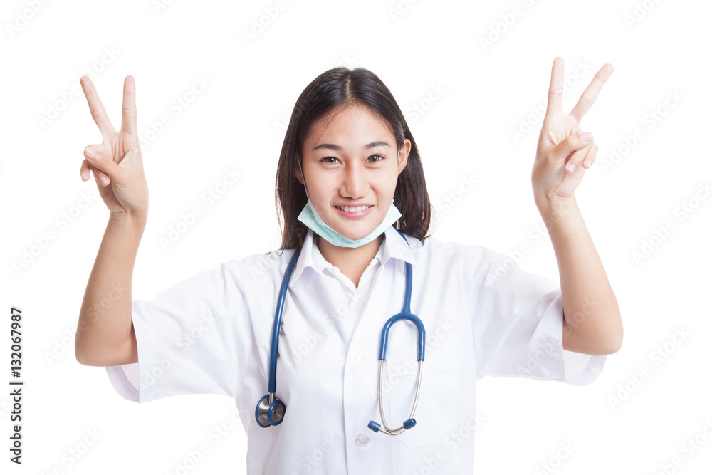 Young Asian female doctor show victory sign with both hands. Young Asian female doctor show victory sign with both hands.