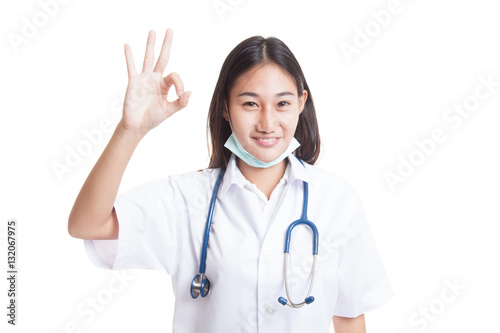 Young Asian female doctor show OK sign.