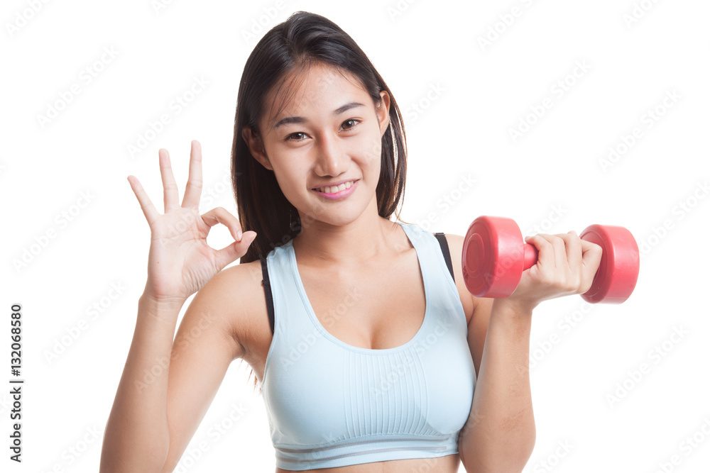 Beautiful Asian healthy girl show OK with dumbbell. Beautiful Asian healthy girl show OK with dumbbell.