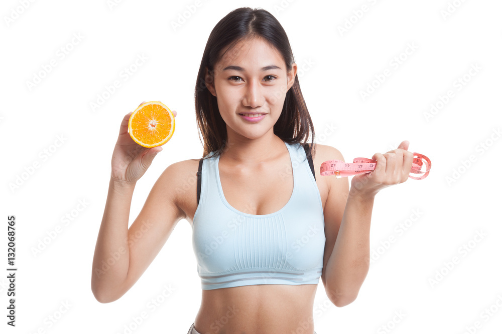 Asian healthy girl on diet with orange fruit and measuring tape. Asian healthy girl on diet with orange fruit and measuring tape.