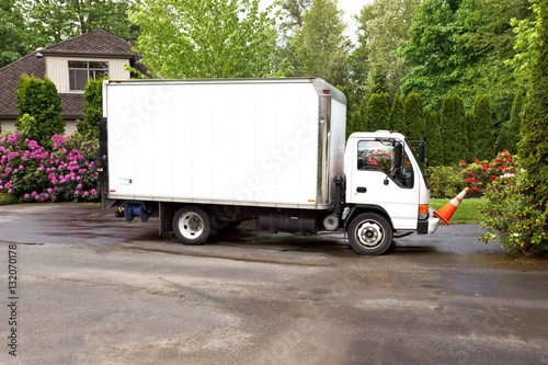 Worker's truck parked in a home's driveway