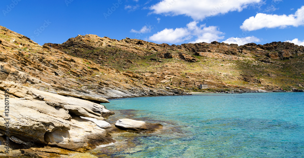 Rocky coast with crystal blue water near Monastiri beach. Paros island in Greece. Cyclades. Europe.