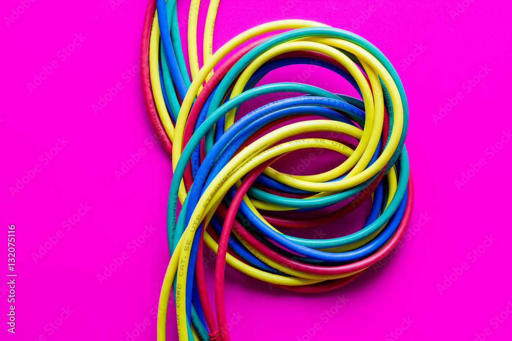 concept network internet cable on pink background close up