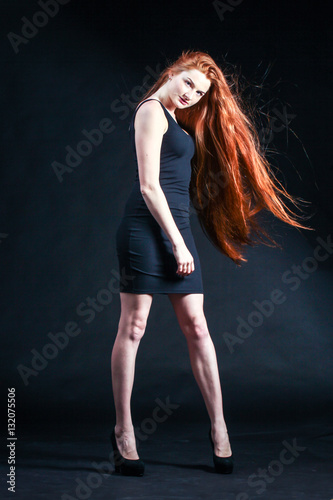 Beauty ginger Girl Portrait. Healthy Long Red Hair. Beautiful Yo