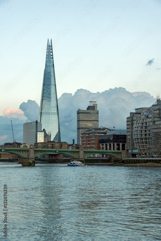 LONDON, ENGLAND - JUNE 17 2016: Twilight on the Thames river and The Shard, London, Great Britain