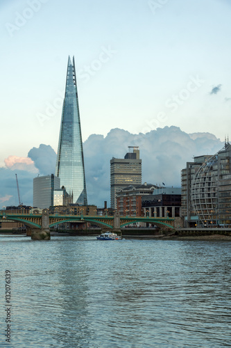 LONDON, ENGLAND - JUNE 17 2016: Twilight on the Thames river and The Shard, London, Great Britain