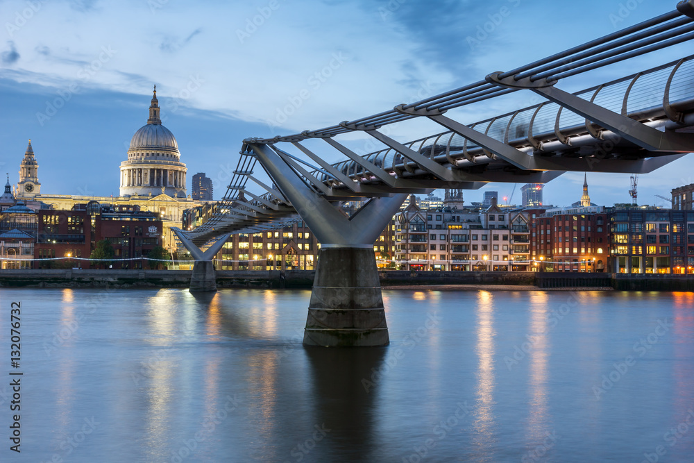 LONDON, ENGLAND - JUNE 17 2016: Night photo of Millennium Bridge and  St. Paul Cathedral, London, Great Britain