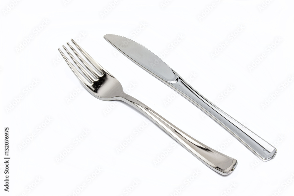 Cutlery set with Fork, Knife and Spoon isolated on white backgro Cutlery set with Fork, Knife and Spoon isolated on white backgro