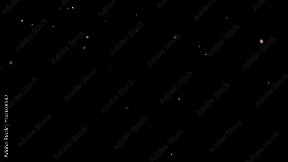 Particles flying on a black background. Colored particles flying erratically. Particles flying on a black background. Colored particles flying erratically.