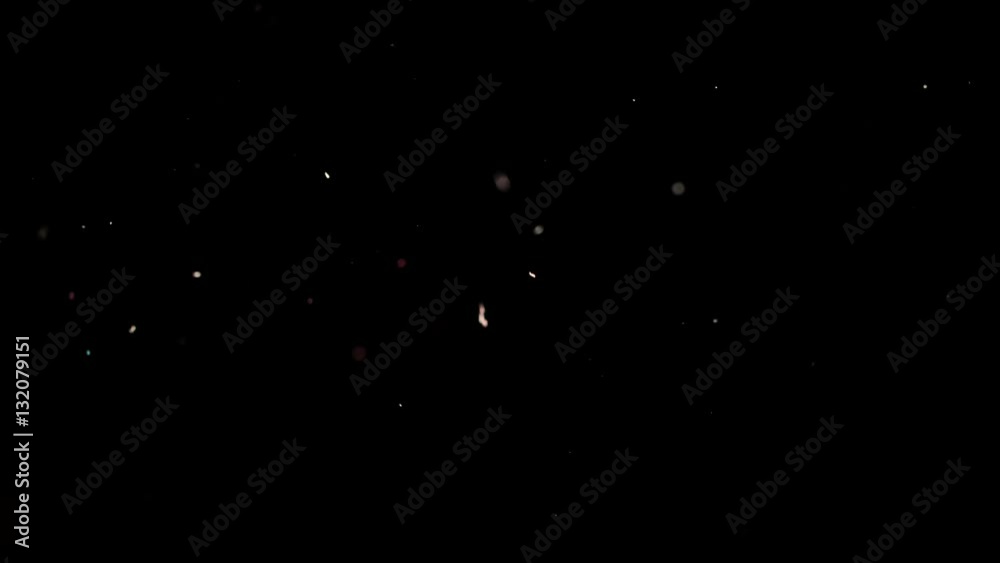 Particles flying on a black background. Colored particles flying erratically. Particles flying on a black background. Colored particles flying erratically.