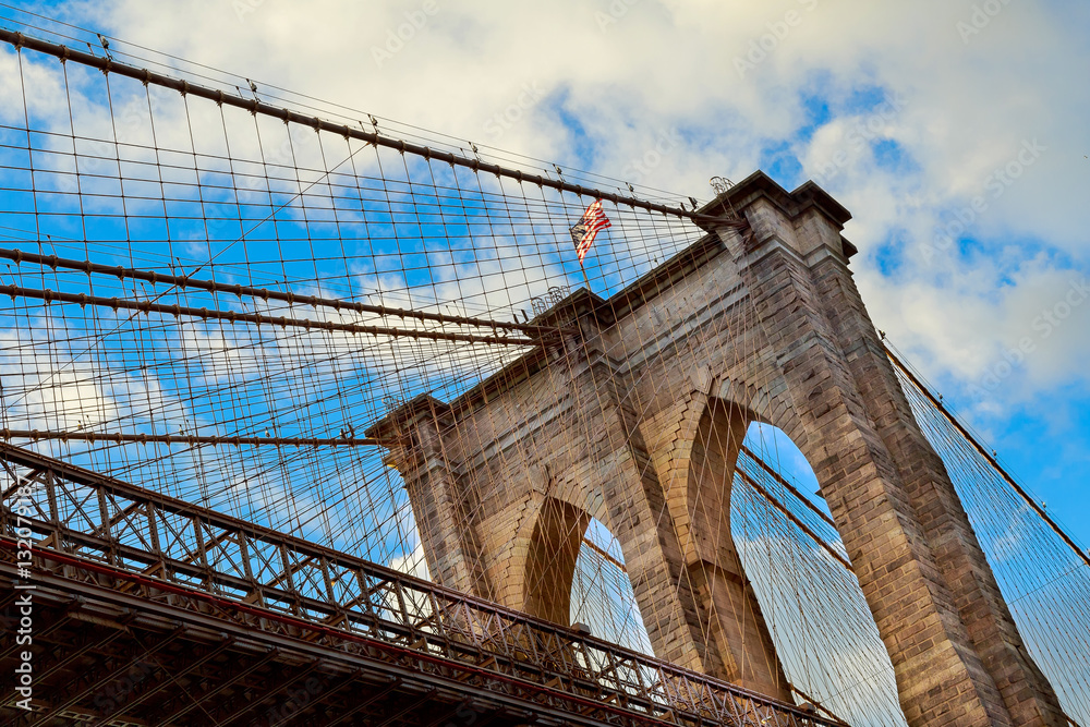 Fototapeta premium Clouds above Brooklyn Bridge, wide angle view - New York