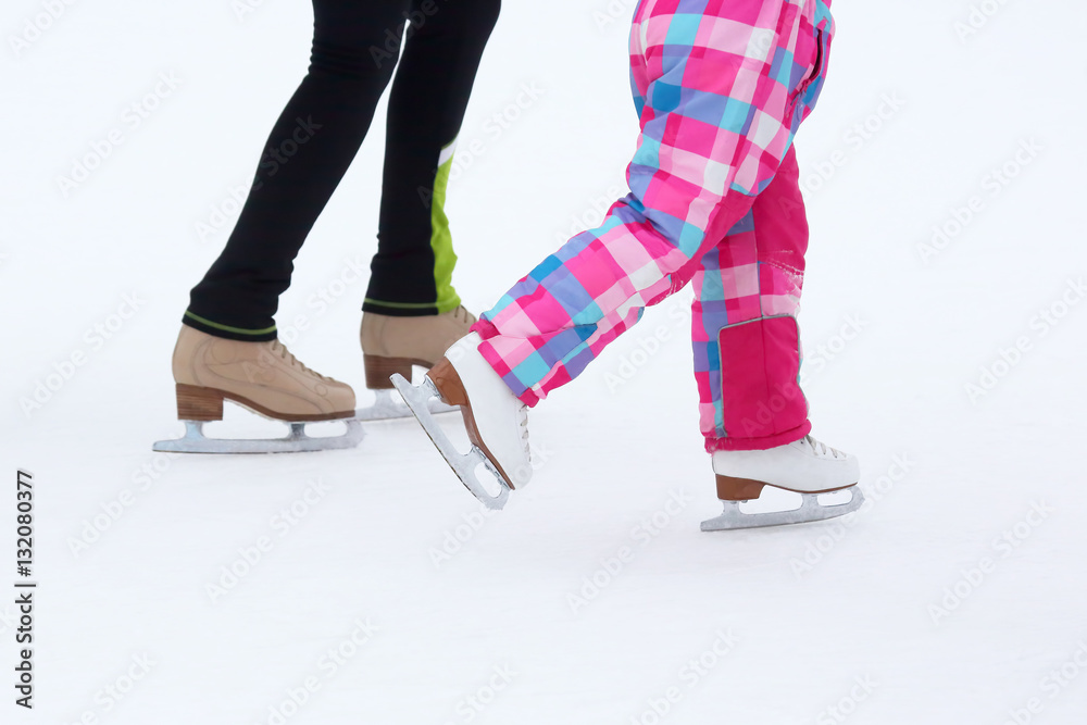 foot skating little girls and women on an ice rink foot skating little girls and women on an ice rink