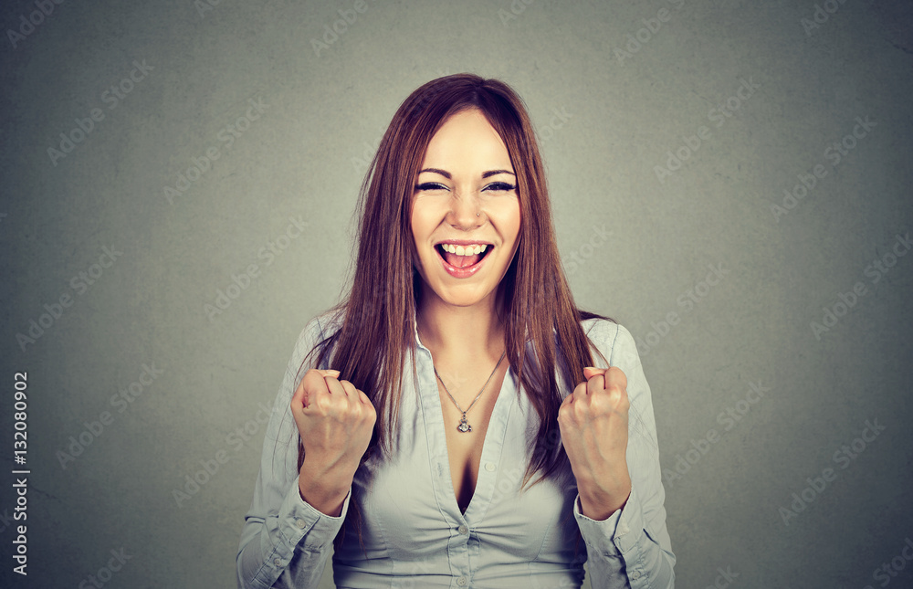 successful woman with fists pumped celebrating success successful woman with fists pumped celebrating success