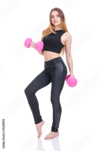 .Diet. Young beautiful girl with pink dumbbells in his hands. Girl performs sporting exercise.