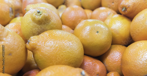 Bunch of fresh organic mandarin oranges on market 
