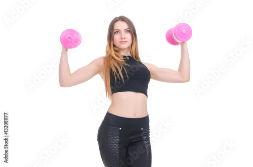 .Diet. Young beautiful girl with pink dumbbells in his hands. Girl performs sporting exercise. © salomonus_