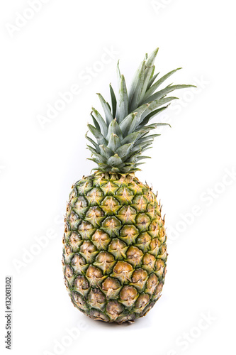 Ripe fresh whole pineapple isolated on a white background