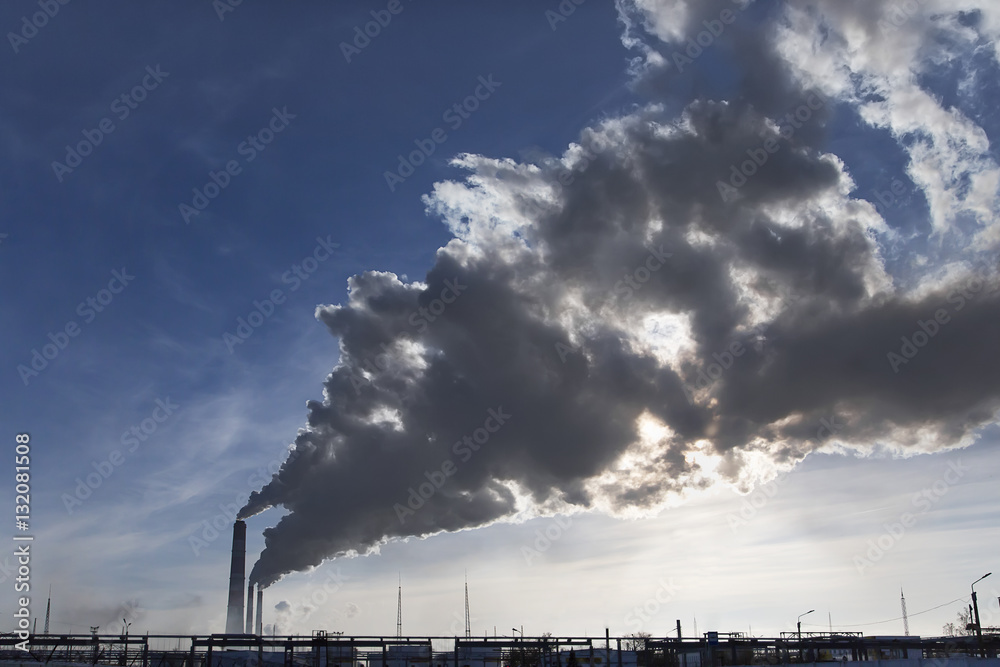 Industrial smoke from chimney on blue sky Industrial smoke from chimney on blue sky
