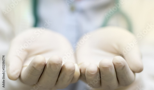 hand with surgical glove,sterile glove