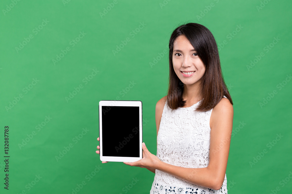 Woman showing the blank screen of digital tablet computer Woman showing the blank screen of digital tablet computer