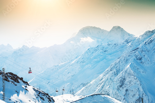 Cable car on the ski resort in the winter mountains