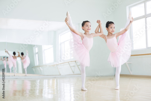 Little girls practicing ballet at dance studio