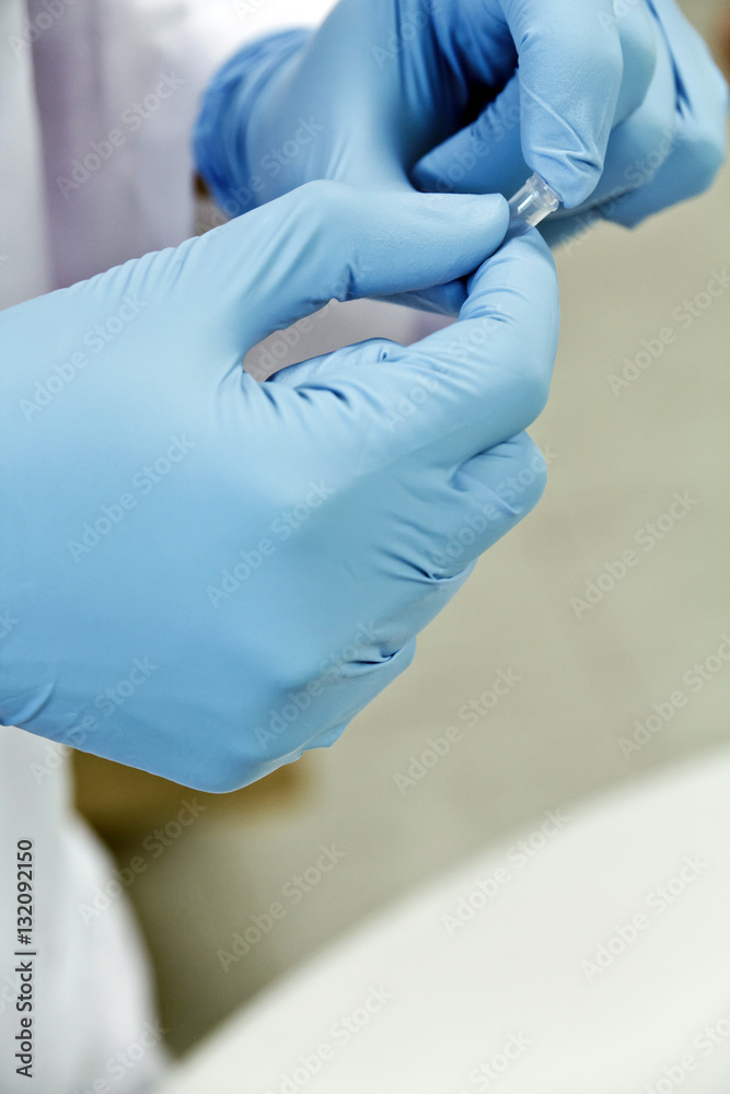 Scientist holding a test tube Scientist holding a test tube