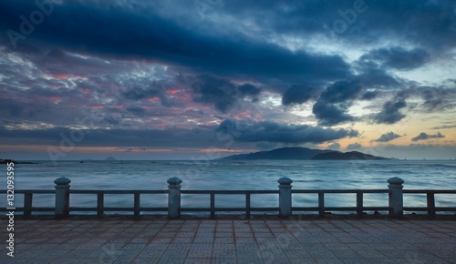 A colourful cloudy morning sky over the south china sea and  islands of the coast of Nha Trang central Vietnam. photo
