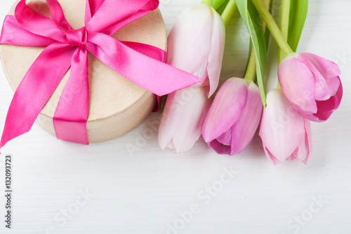 Red pink yellow tulips and gift box with red ribbon