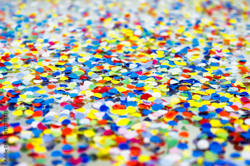 Background of handmade confetti in vibrant cheerful colors.
