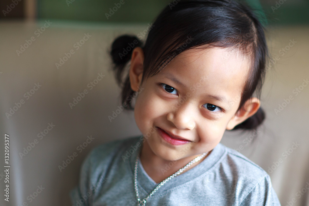 Portrait of a beautiful smile liitle girl close-up,Selective foc Portrait of a beautiful smile liitle girl close-up,Selective foc