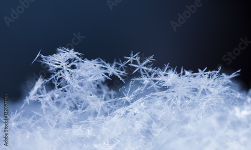 photo real snowflakes during a snowfall, under natural conditions at low temperature