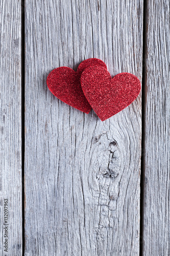 Valentine day background, handmade hearts on wood with copy space