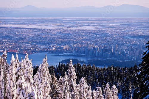 Winter sunset over city of Vancouver. View from Hollyburn Mountain. Cypress Provincial Park. North Vancouver. British Columbia. Canada.