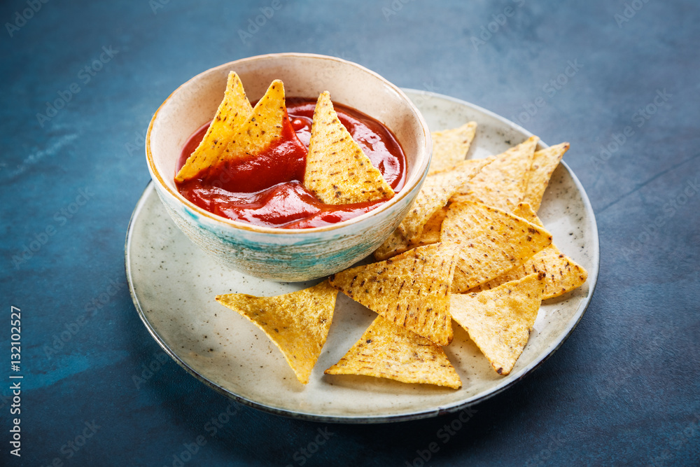 Nachos on plate and red sauce Nachos on plate and red sauce