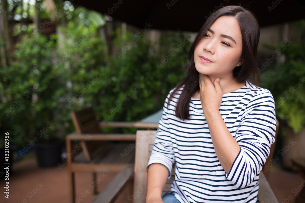 Fototapeta premium Woman has sore throat at coffee shop