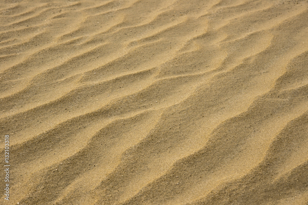 closeup of sand pattern of a beach in the summer closeup of sand pattern of a beach in the summer