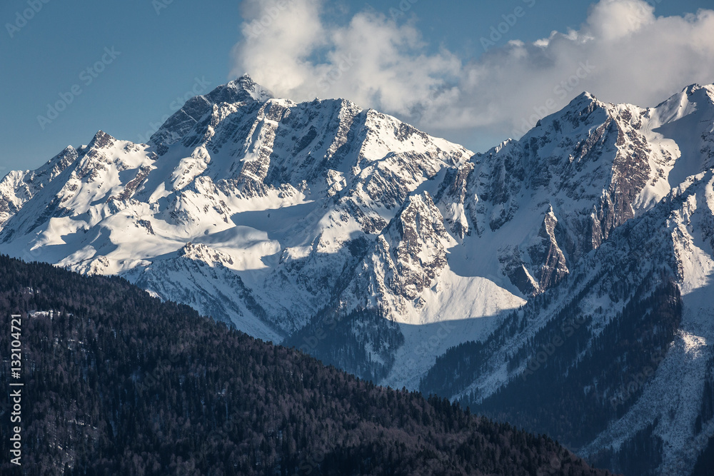 Evening view of the Caucasus mountains. Krasnaya Polyana, Sochi National Park, Russia.