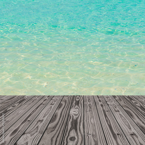 Wood grain deck floor over beautiful sea water background