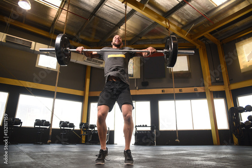 Strong man doing a crossfit power lift 