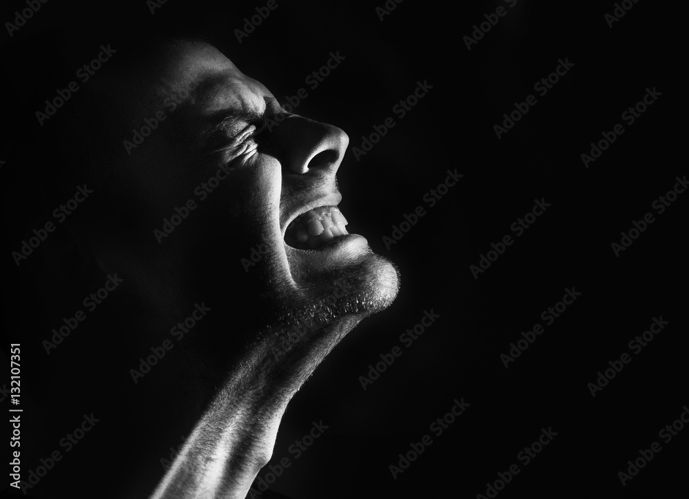 guy a man in pain agony clenched teeth black and white portrait