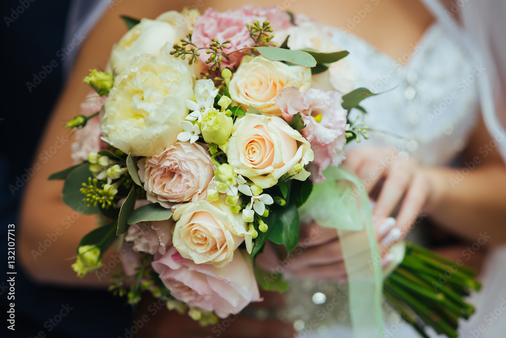 bridal bouquet in hands of the bride