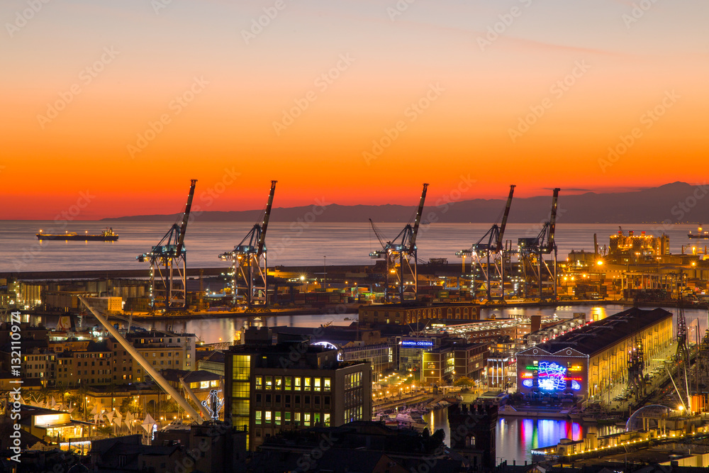GENOA (GENOVA) , ITALY, DECEMBER 28, 2016: Sunset view of the city of Genoa, Italy, The harbor with Lanterna (lighthouse) the symbol of the city. GENOA (GENOVA) , ITALY, DECEMBER 28, 2016: Sunset view of the city of Genoa, Italy, The harbor with Lanterna (lighthouse) the symbol of the city.