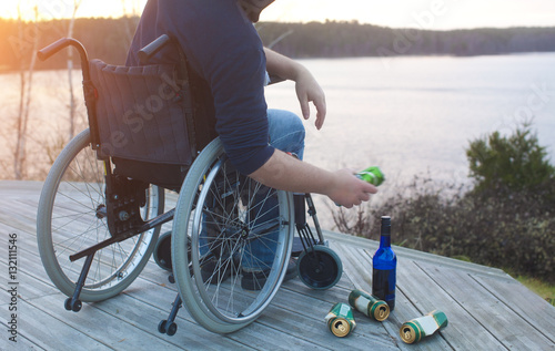 Man in a wheelchair drinking alcohol