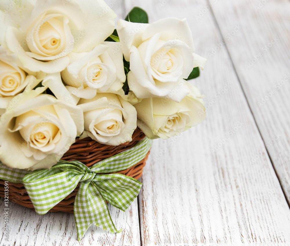 White roses in a basket White roses in a basket