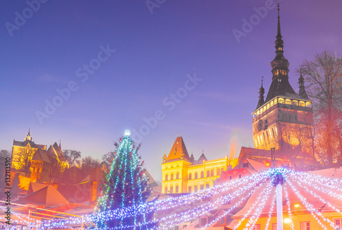 Christmas market and decorations tree in the main center of Sighisoara town, in winter season, Romania