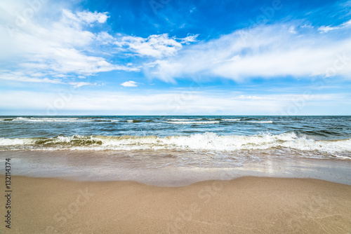 Fototapeta Naklejka Na Ścianę i Meble -  Blue sky and sea beach, landscape, coast with waves in the summer vacation, Poland, Baltic