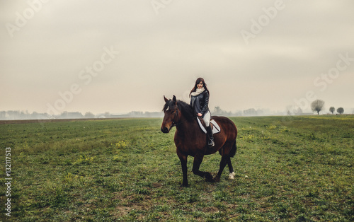 Beautiful girl riding a horse © Cheberkus