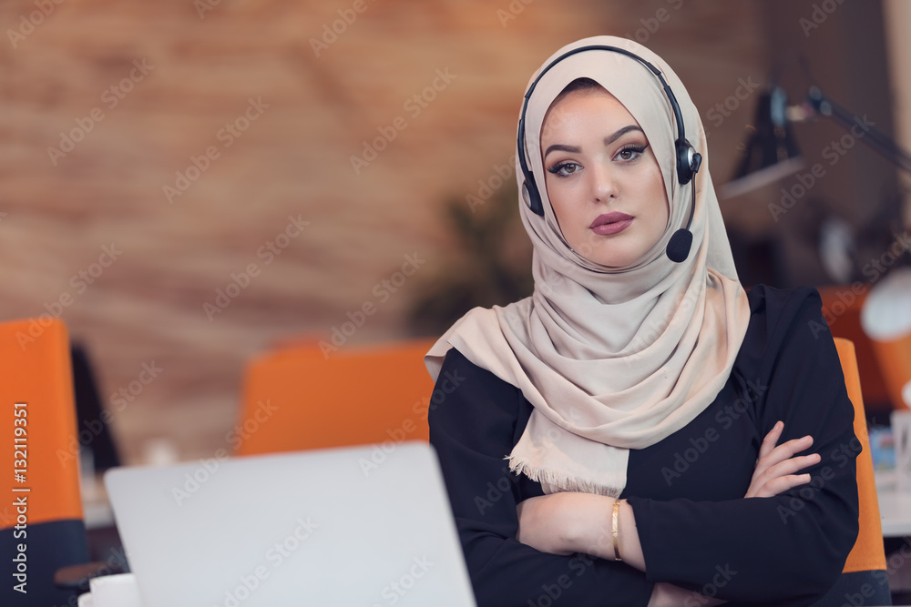 Beautiful phone operator arab woman working in startup office Beautiful phone operator arab woman working in startup office
